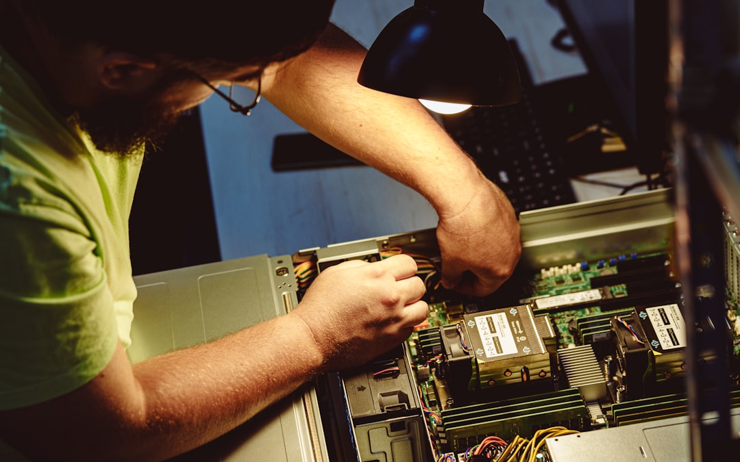 Technician working on server Technician working on server