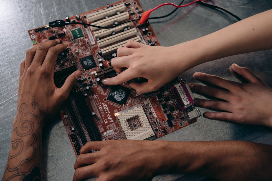 hands on a motherboard hands on a motherboard