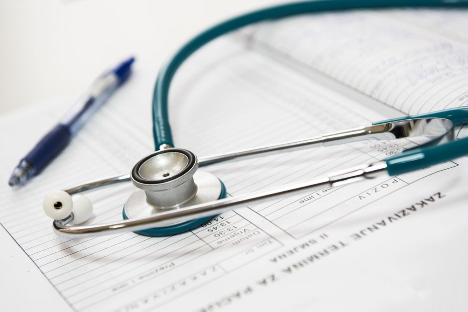 stethoscope resting on medical chart stethoscope resting on medical chart